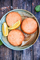 Homemade ketogenic  Salmon Burger with Tartar Sauce and  whole grain ketgenic bread. Healty diet  food