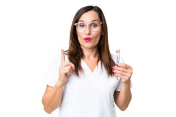 Dentist caucasian woman over isolated chroma key background intending to realizes the solution while lifting a finger up