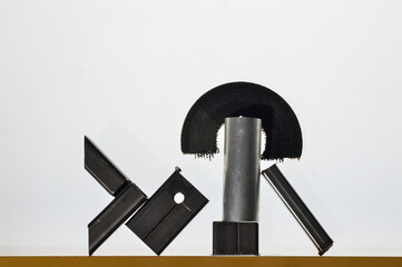 Composition of pieces of metal and a broken disk from a grinder. White background.