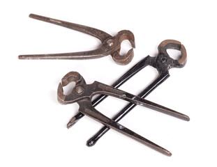 Three old and rusty pairs of pincers