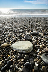 A stone on the seashore on a pebble beach