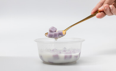 Taro Balls with Sweet Coconut Milk.  Dessert Ready to eat  in plastic bowl.  Bualoy is Thai...