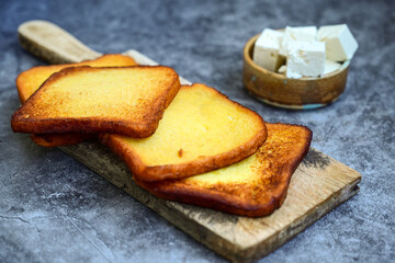 French toast  and white cheese. Rustic breakfast  made from deep fried   bread   with organic free range   eggs