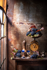 vintage still life, old scales with grapes and wine. beautiful vintage still life.