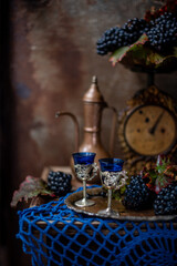 vintage still life, old scales with grapes and wine. beautiful vintage still life.