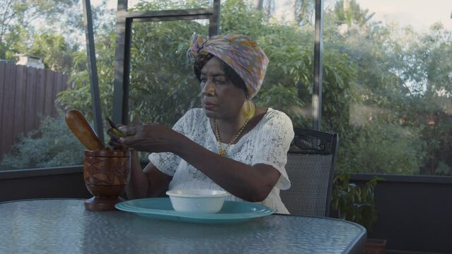 Cutting vegetables into mortar and pestle
