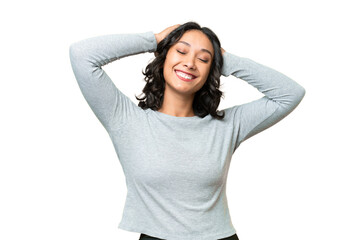 Young Argentinian woman over isolated background laughing - obrazy, fototapety, plakaty