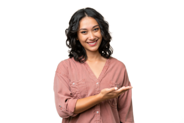 Young Argentinian woman over isolated background presenting an idea while looking smiling towards
