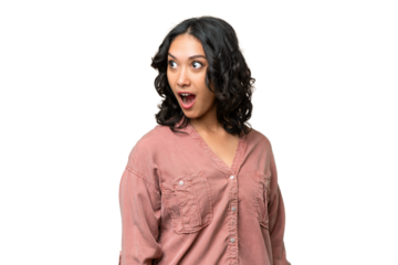 Young Argentinian woman over isolated background doing surprise gesture while looking to the side