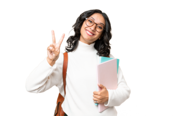 Young Argentinian student woman over isolated background smiling and showing victory sign