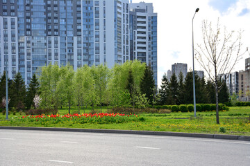 urban landscape with road, buildings and public park