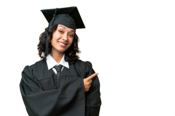 Young university graduate Argentinian woman over isolated background pointing finger to the side