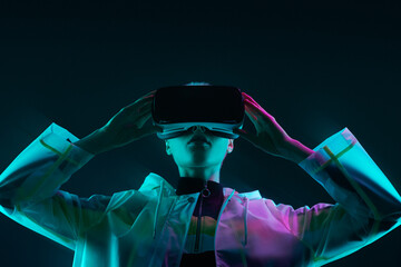 Futuristic woman exploring virtual reality