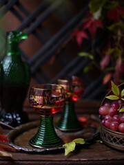 wine in a beautiful green bottle in the form of a bird. grape red wine.