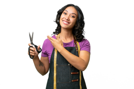 Young seamstress argentinian woman over isolated background extending hands to the side for inviting to come