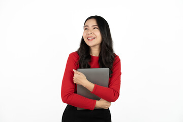 Happy asian business woman holding laptop computer and looking at the camera over white background.