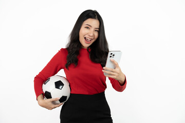 Happy Asian woman football fan cheer up support favorite team with soccer ball isolated on white background.