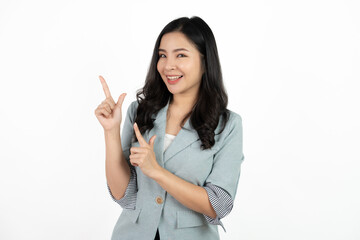 Asian business woman isolated on white background pointing to the side to present a product.