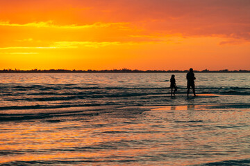 parent and child beach sunset