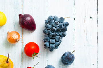 fruits and vegetables on white wooden table