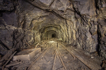 Underground gold mine shaft tunnel drift with rails