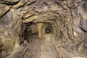 Underground gold mine shaft tunnel drift with rails