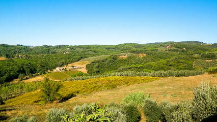 Fototapeta na wymiar Hills, fields and meadows - typical views of Tuscany, Italy.