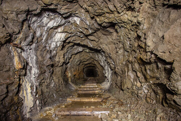 Old iron gold mine underground tunnel