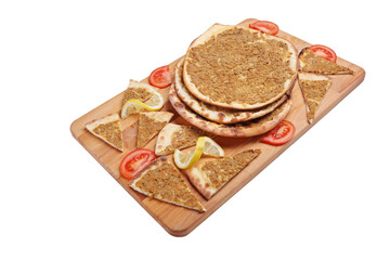 Slices of lahmajun on a wooden tray