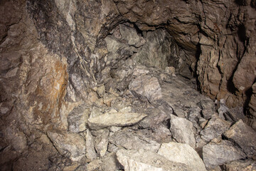 Old gold mine underground tunnel with collapsed roof