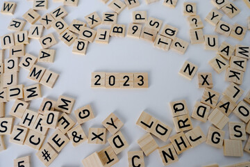 close-up of year change calendar with wood cube block tact 2023 on a light table, business concept,...