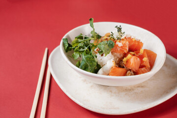 poke bowl salad with fish salmon and greens