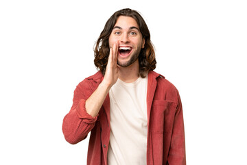 Young handsome man over isolated background with surprise and shocked facial expression