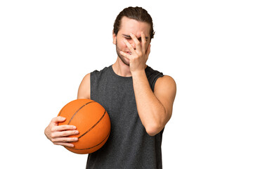 Young basketball player man over isolated background with tired and sick expression