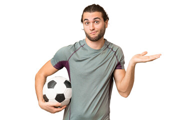 Young handsome football player man over isolated background having doubts while raising hands