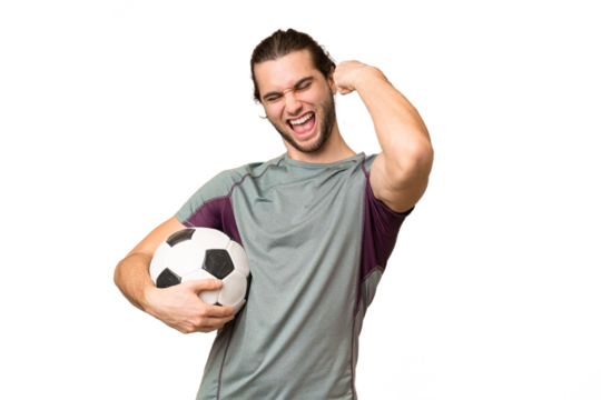 Young handsome football player man over isolated background celebrating a victory