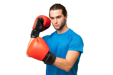 Young handsome man isolated on green chroma background with boxing gloves