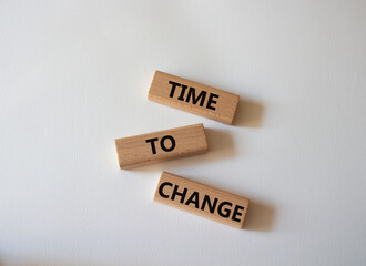 Time to change symbol. Concept word Time to change on wooden blocks. Beautiful white background. Business and Time to change concept. Copy space