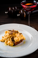 Breakfast rye bread toast with fried scrambled egg and onions.