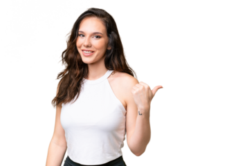 Young caucasian woman isolated over isolated background pointing to the side to present a product