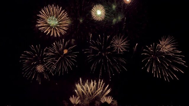 Amazing beautiful colorful firework display over sea on celebration night. Fireworks show for happy new year	