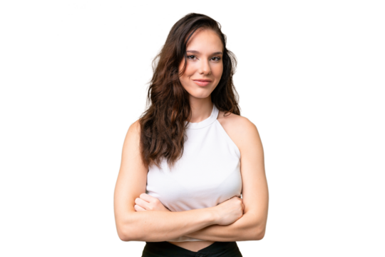 Young caucasian woman isolated over isolated background with arms crossed and looking forward