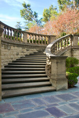 stone balustrade outlines the grand staircase leading to the courtyard