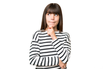 Little caucasian girl over isolated background having doubts and thinking