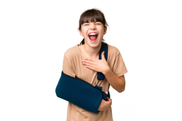Little caucasian girl with broken arm and wearing a sling over isolated background smiling a lot