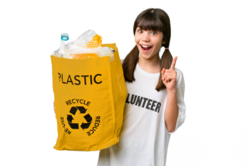 Little caucasian girl holding a bag full of plastic bottles to recycle over isolated background pointing up a great idea
