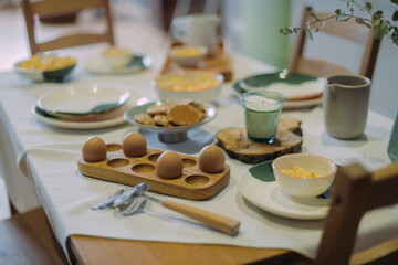Details of a modern kitchen in a Scandinavian rustic style in light green shades.