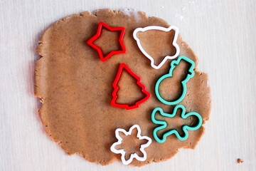 Dough for ginger cookies with Christmas molds.