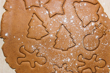 Dough for ginger cookies with Christmas molds.