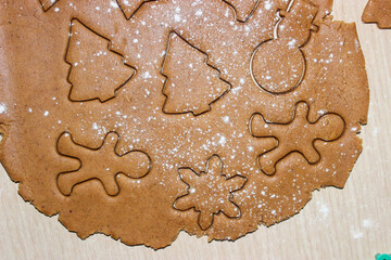 Dough for ginger cookies with Christmas molds.